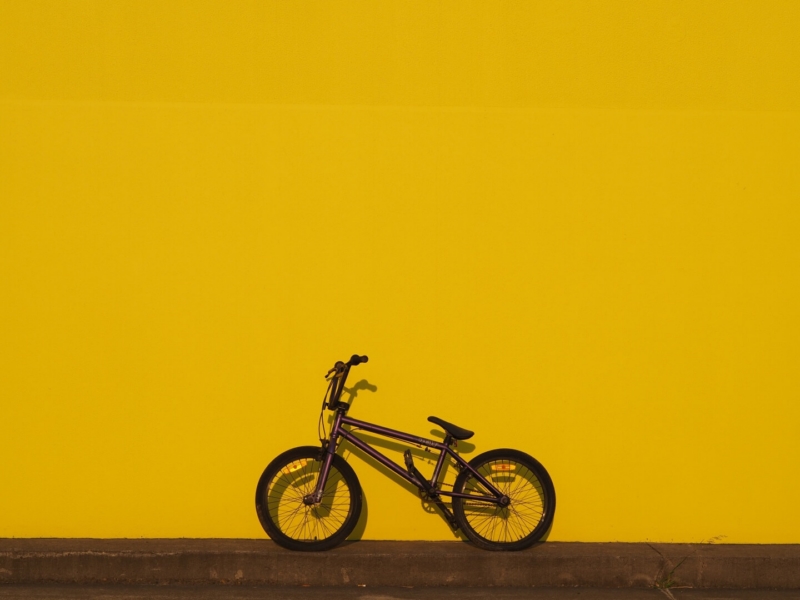 Honour For Purple Bike Yellow Wall By Trudi Aykens